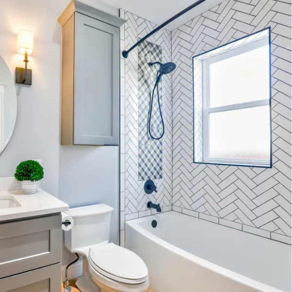 Small bathroom renovation with modern vanity vessel sink and white subway tile walls