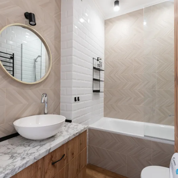 Contemporary bathroom remodel featuring freestanding tub glass shower and wood-look tile