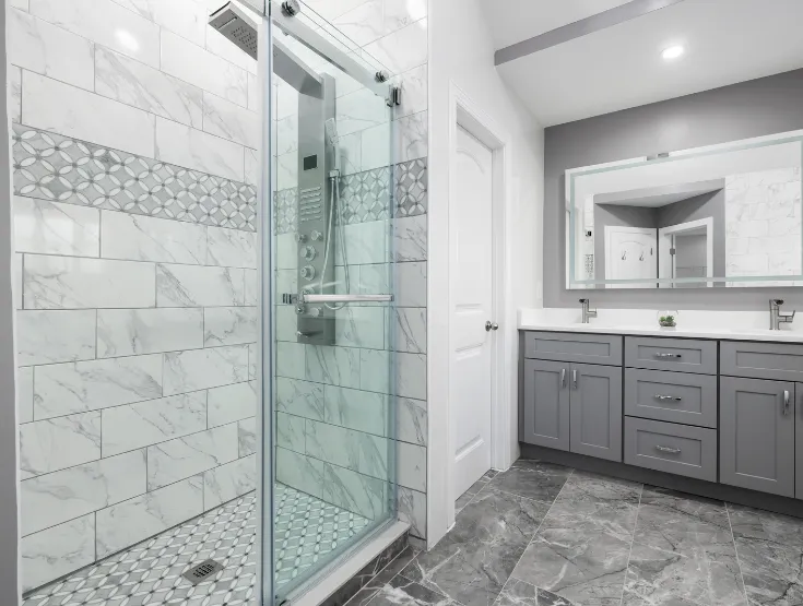 Shower renovation with glass doors and gray vanity during bathroom remodel in Delaware