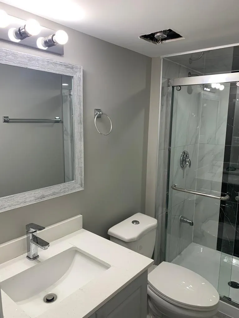 Rising Hill finished basement bathroom with glass shower