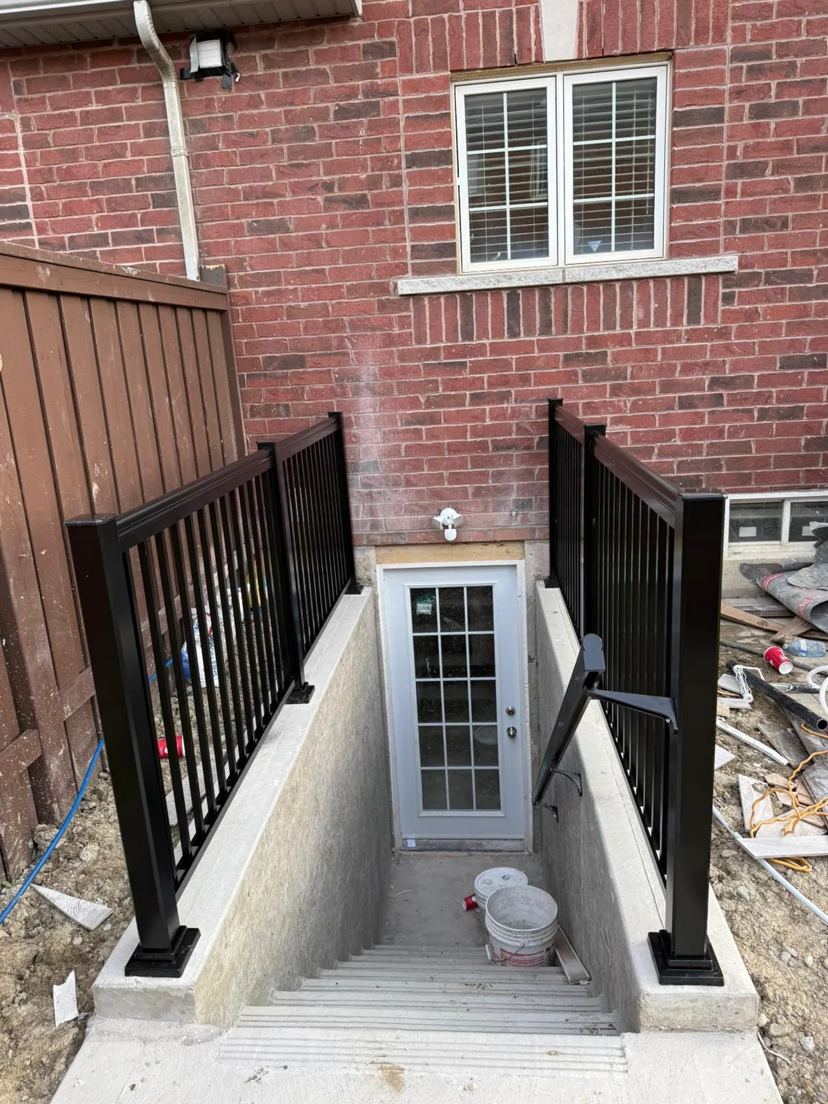 Rising Hill separate basement entrance at a red-brick home