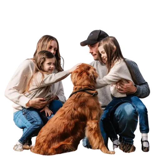 Happy family playing with their dog