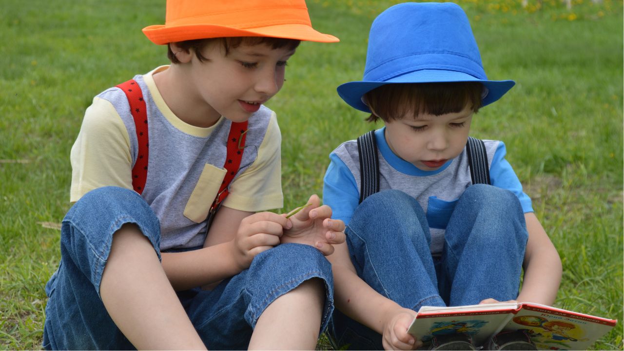 A person holding money in front of a computer screen