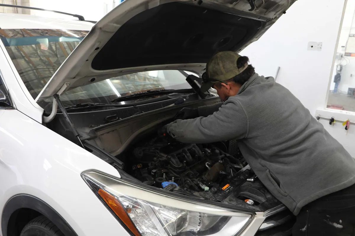 mechanic performing oil change