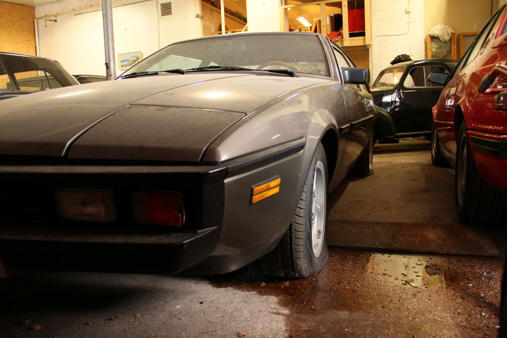 bitter sc with flat tires in a bid empty garage