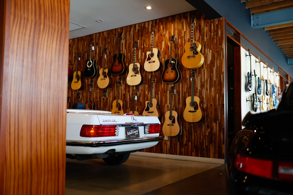 the behind of a Mercedes 560 SL in the guitar  room of Walt grace Vintage