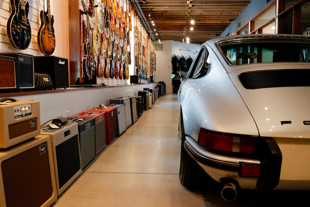 the read of a porsche 911 inside the guitar room of Walt Grace