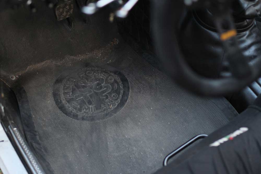alfa romeo brand on the drivers mat