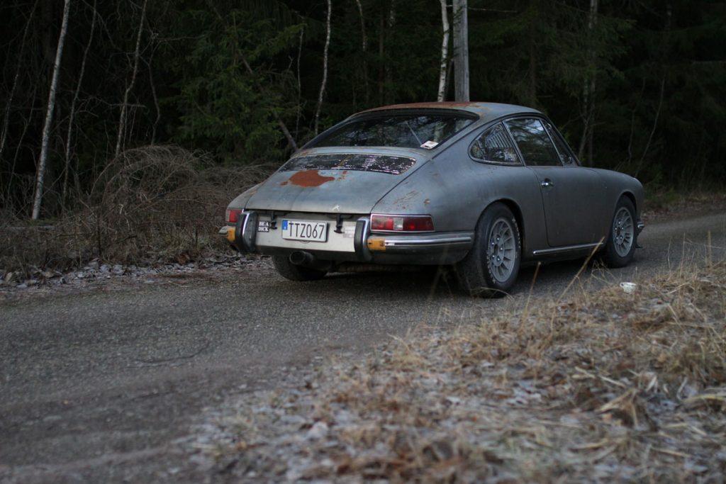 the porsche 912 in the forest with rust n