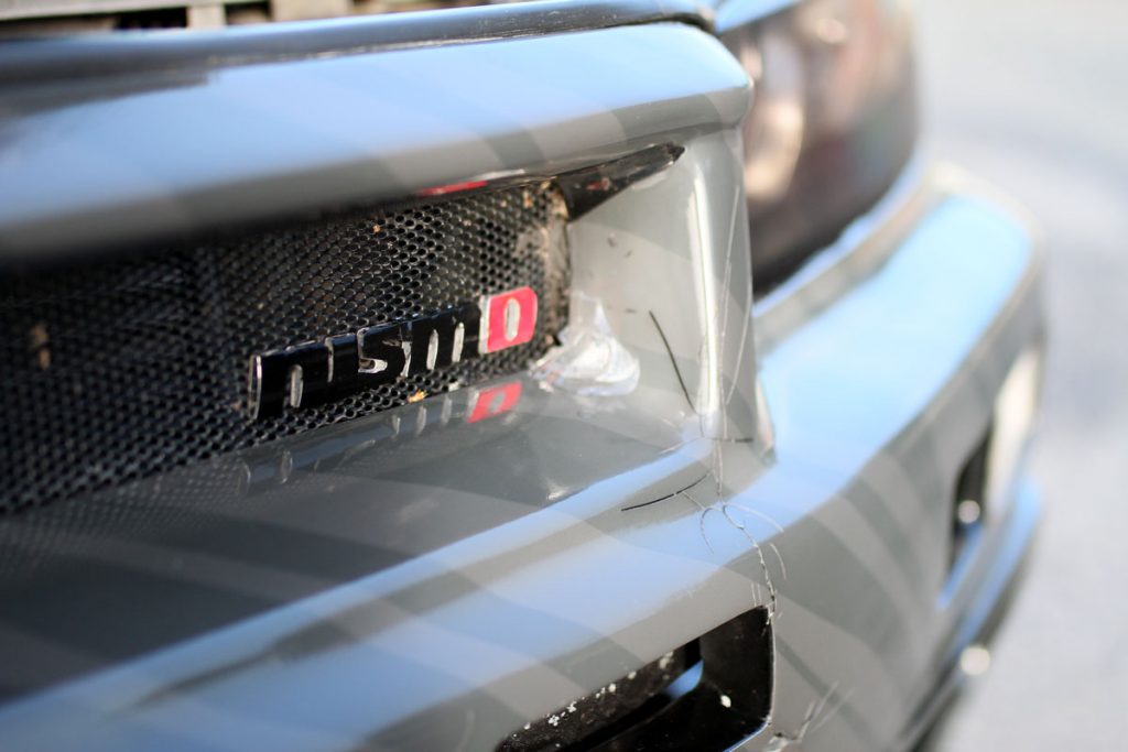 smashed up front of a nissan r34