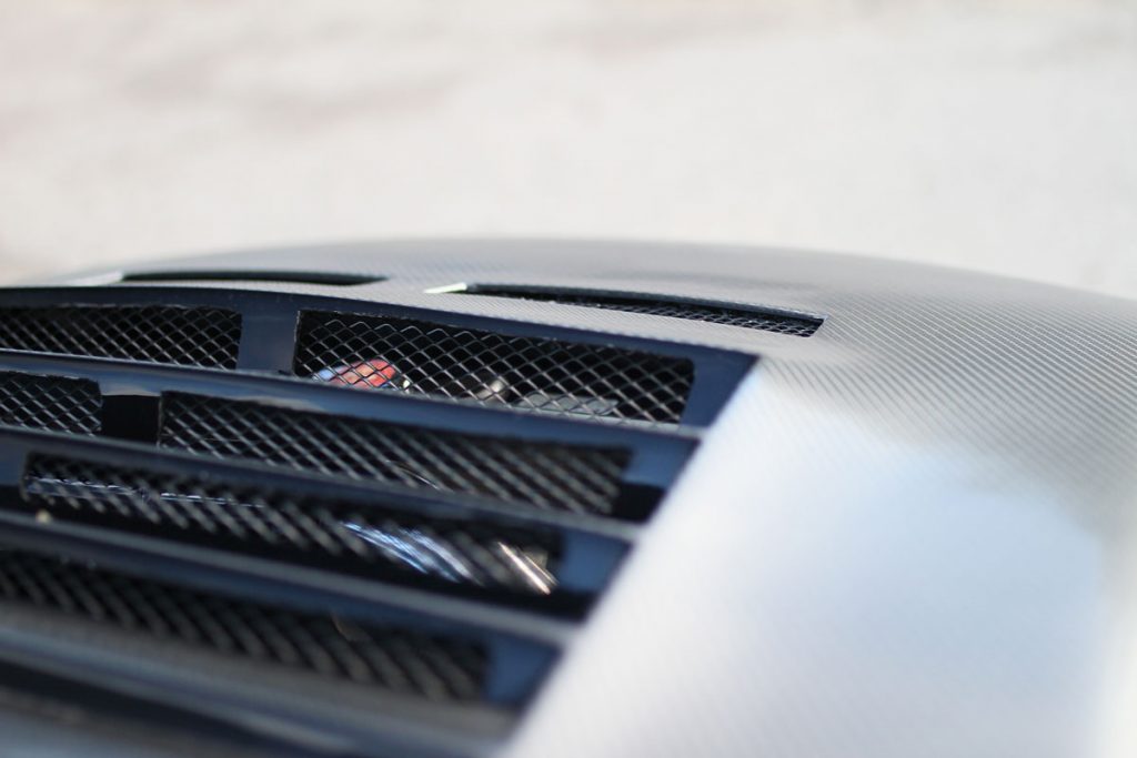 the gelds on the carbon hood on a nissan r34