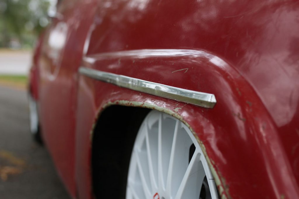 the right fender close on a red saab 96