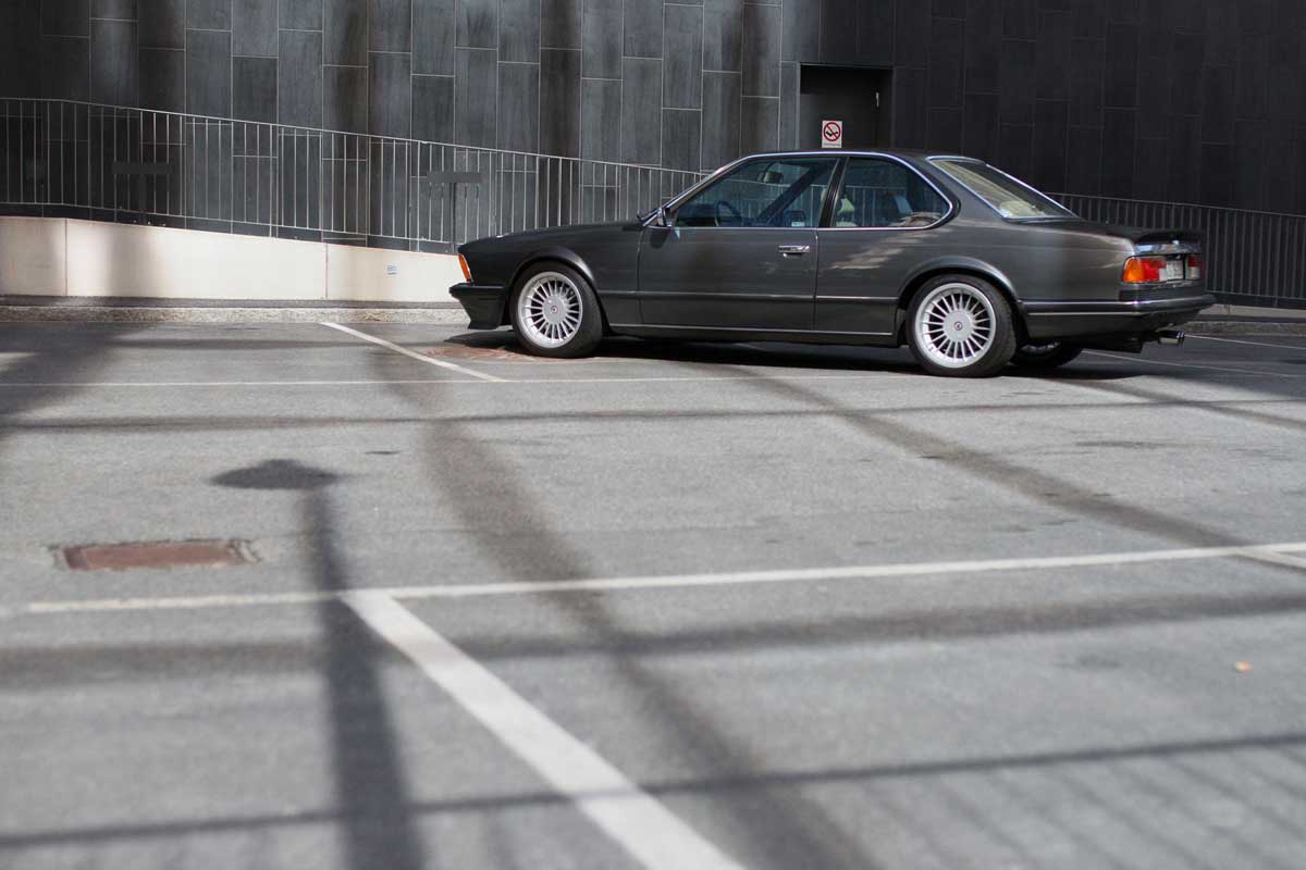 bmw 635 csi  in parkinglot with sun