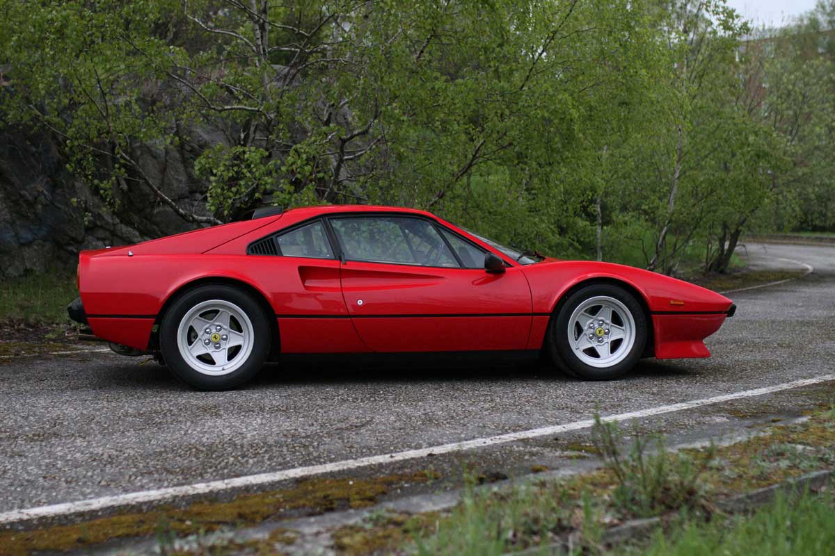 profile of a red ferrari 308 