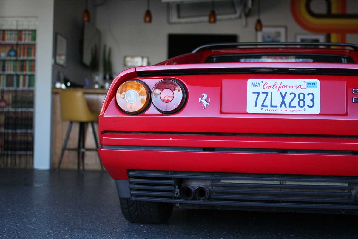 the behind ferrari 329 at the garage 77