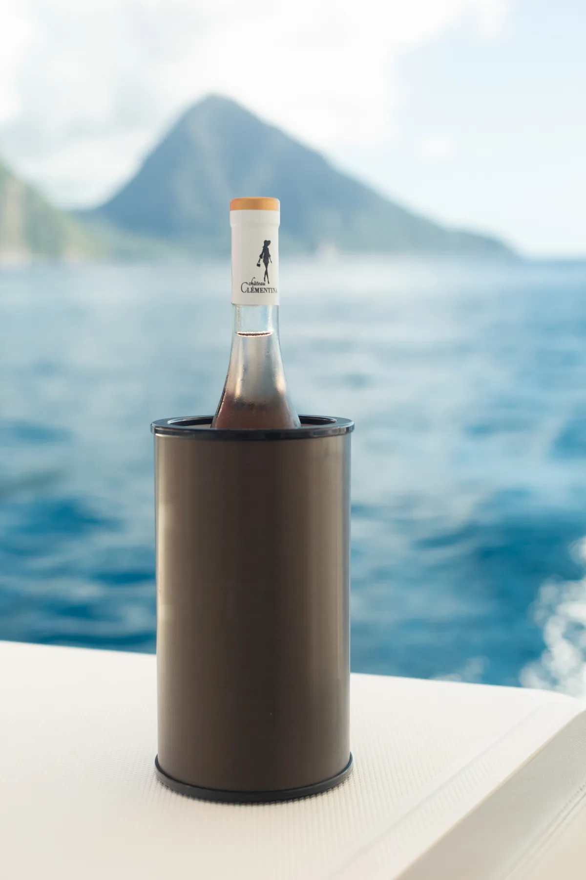 The Hielo wine cooler in front of a tropical ocean backdrop