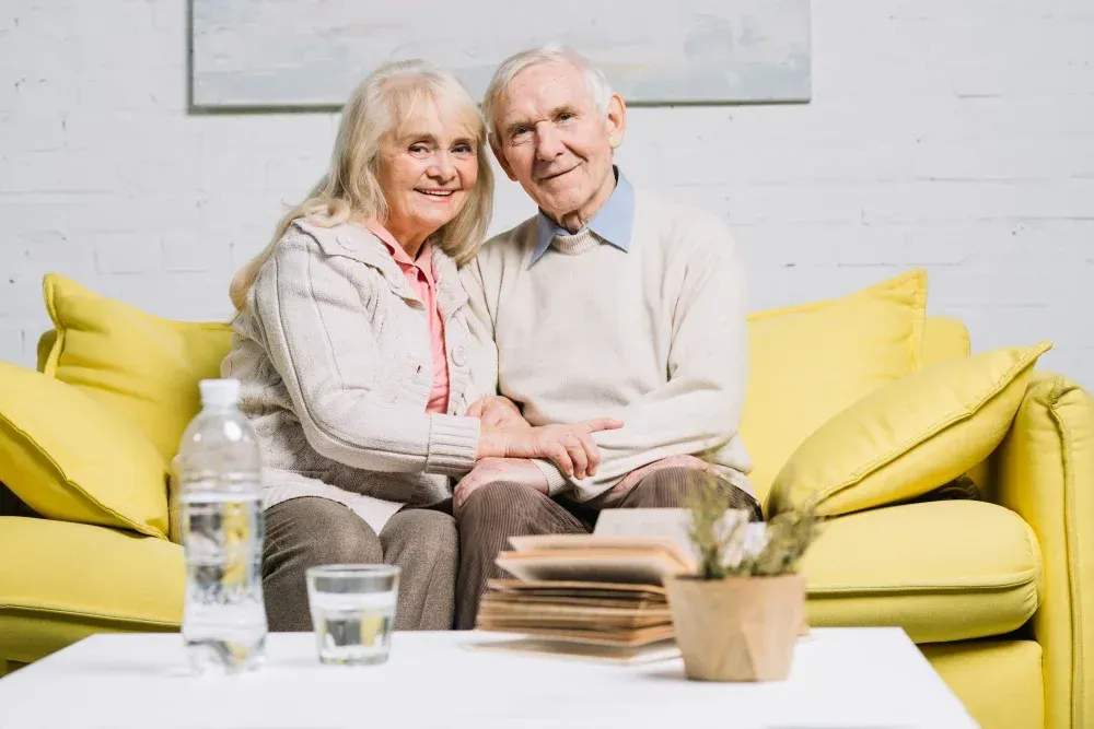 Elderly woman sitting at a kitchen table