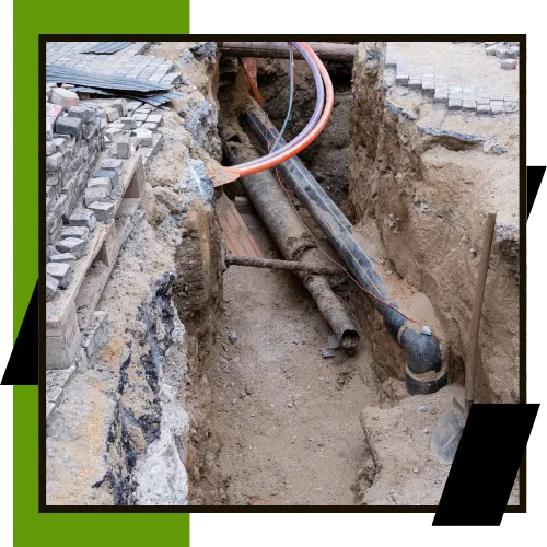 Plumbing team inspecting a home sewer line before replacement 