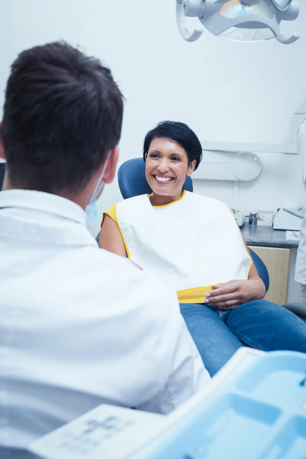 a person getting her teeth checked