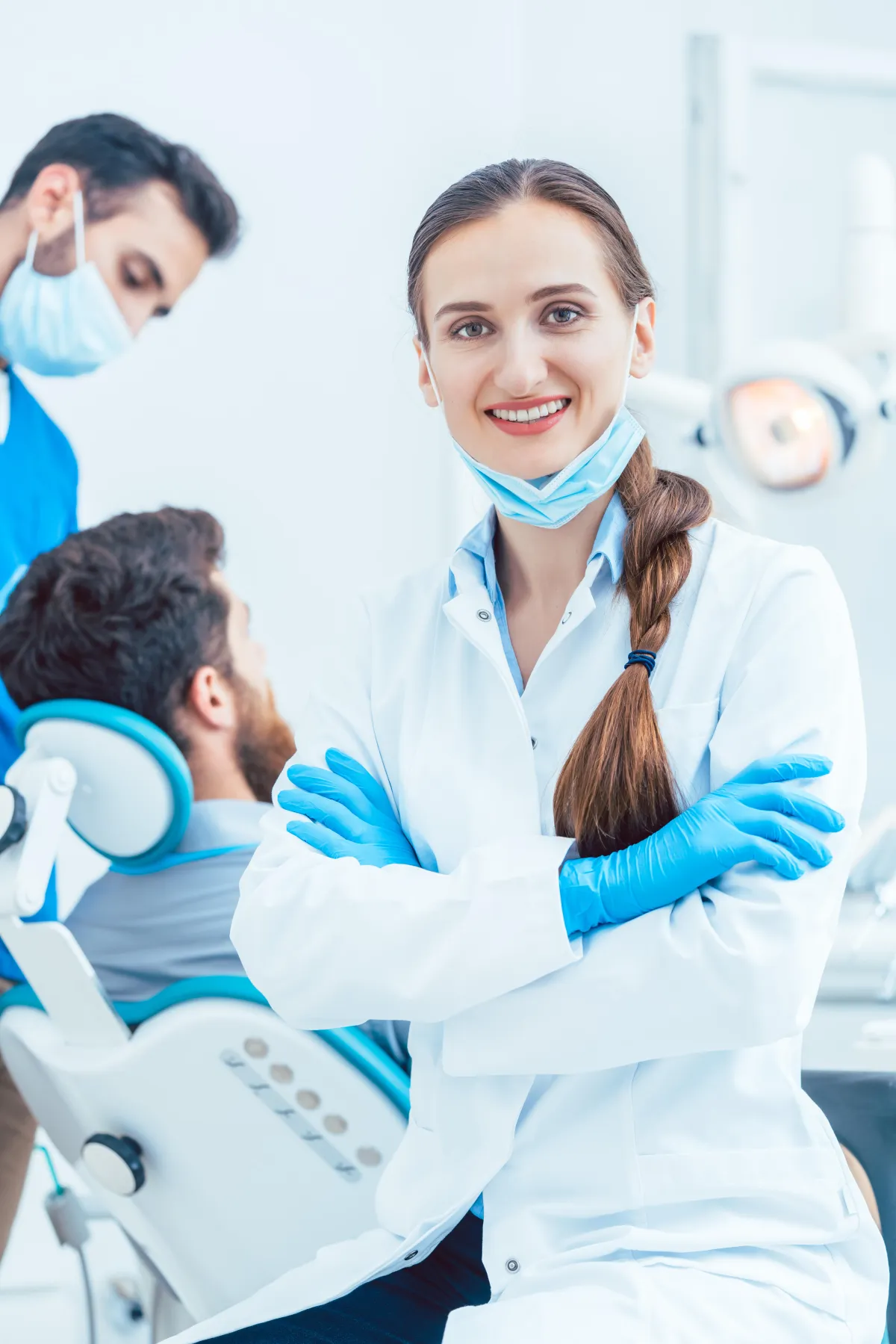 a dentist holding a dental tool over a person's mouth