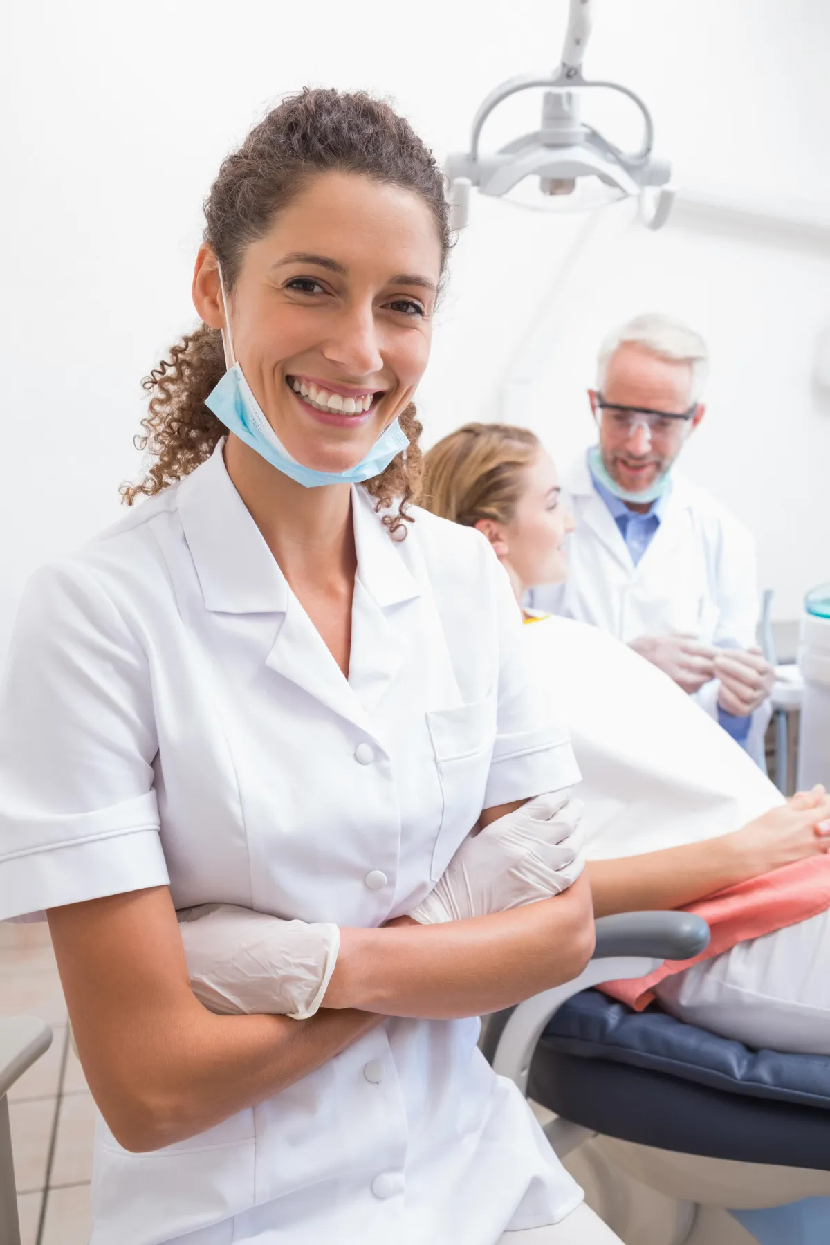 a dentist holding a dental tool over a person's mouth