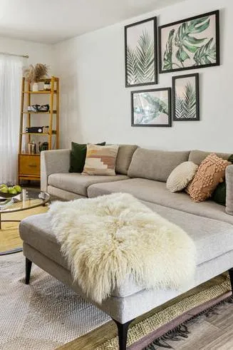 woman setting sheets on bed