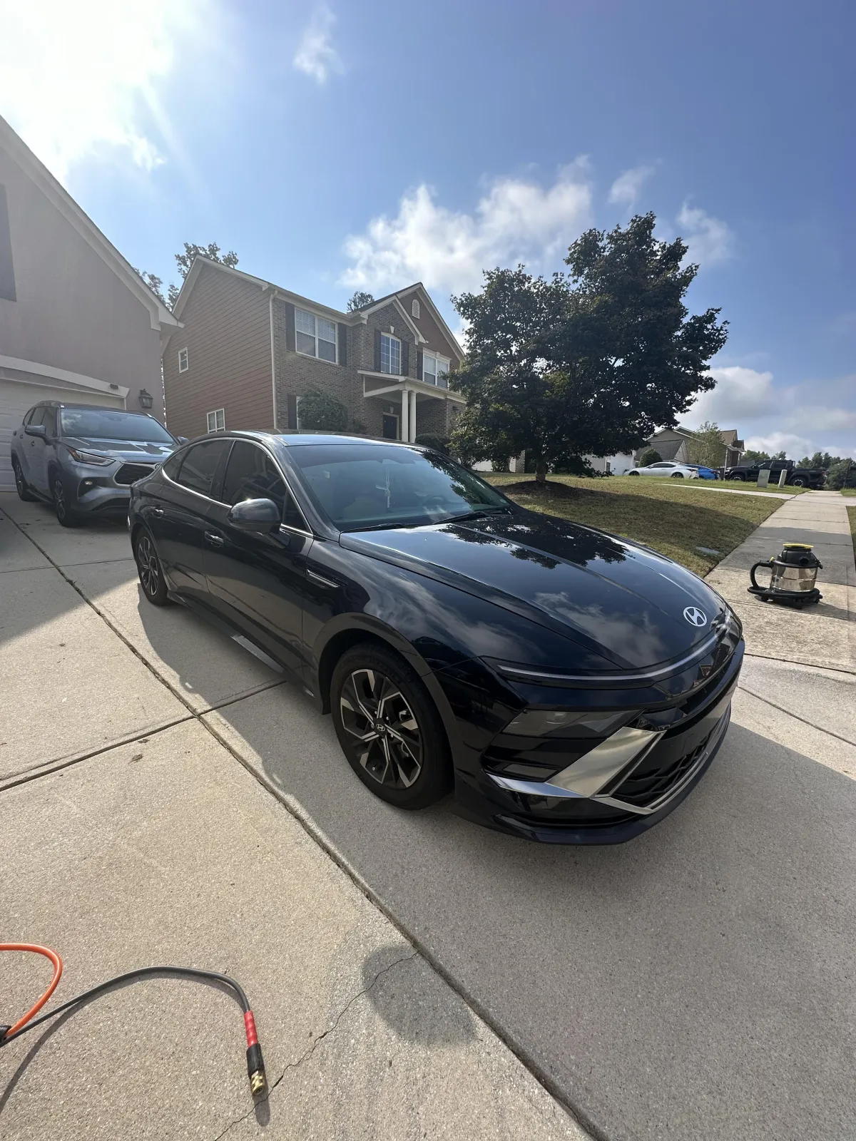 a black car parked on a road