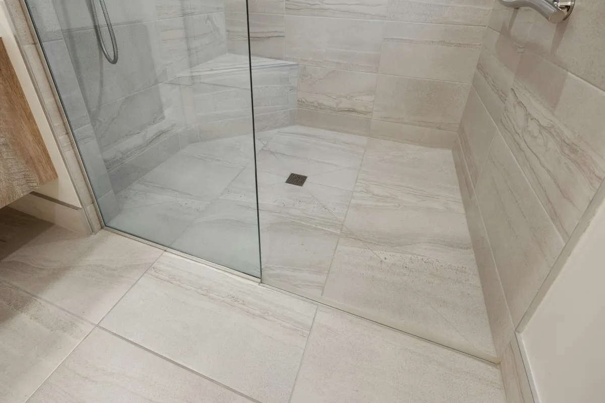 dresser near glass shower stall