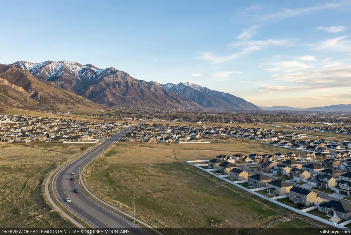 Aerial view of Utah homes in Eagle Mountain neighborhood with Oquirrh Mountains in background