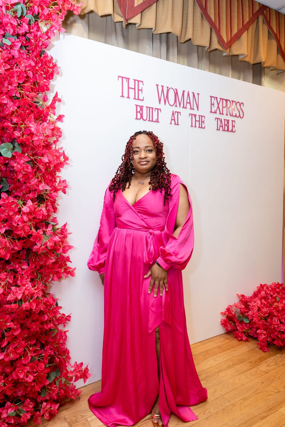 Woman near The Woman Express event backdrop