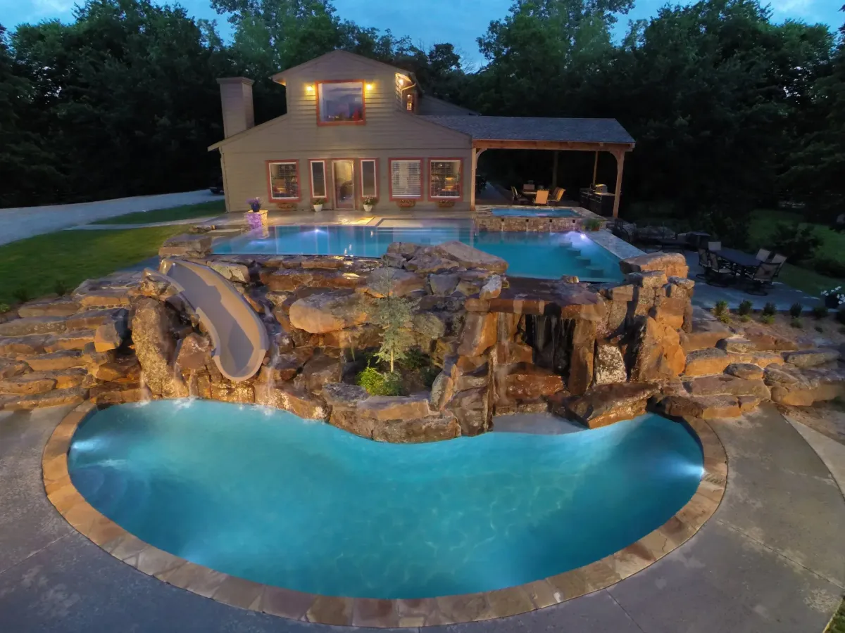 a swimming pool next to a beach
