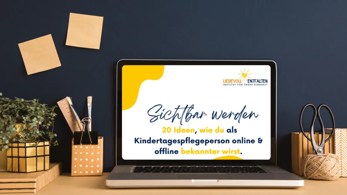 a large yellow object sitting in front of a building