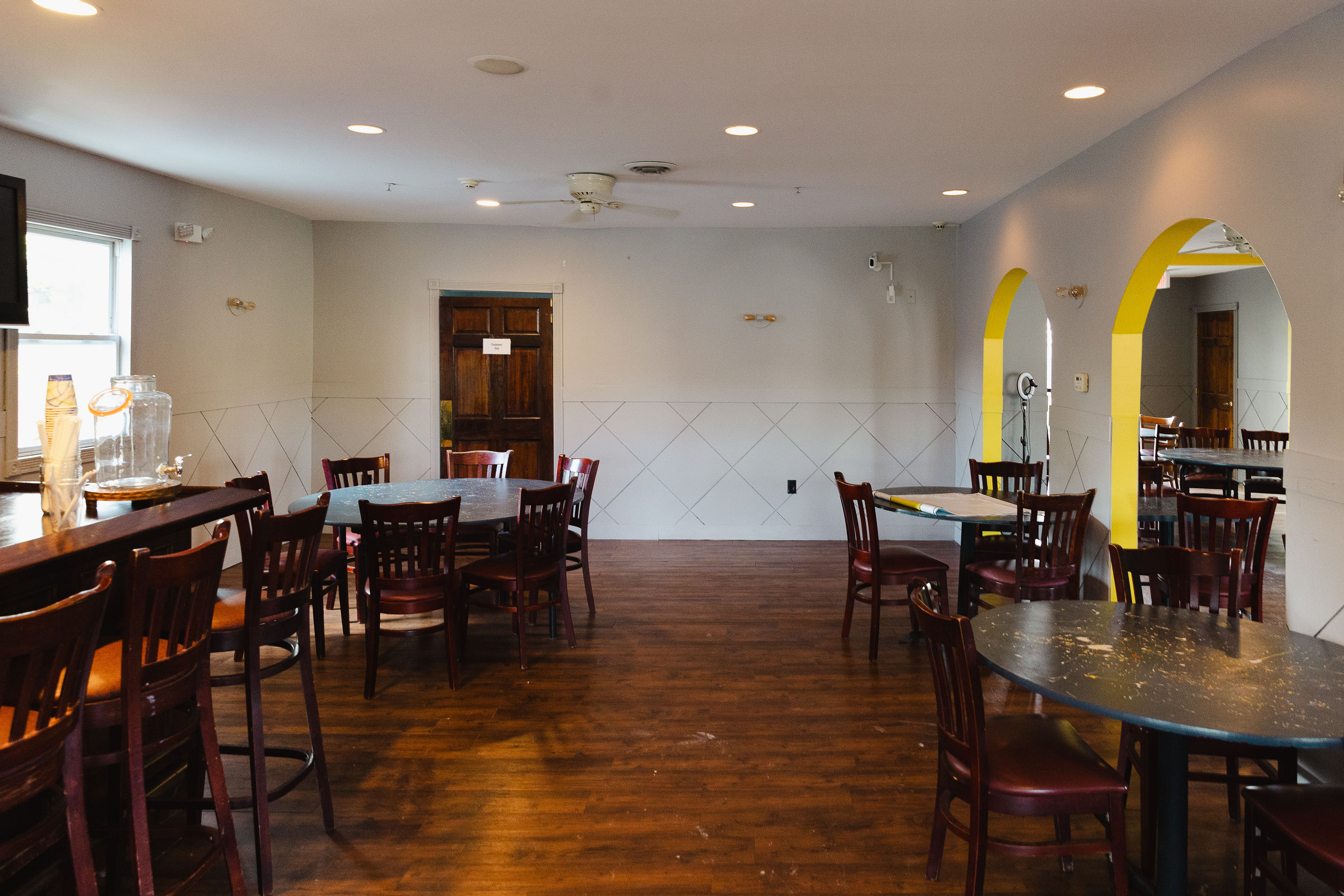 Dining area framed by the yellow arches
