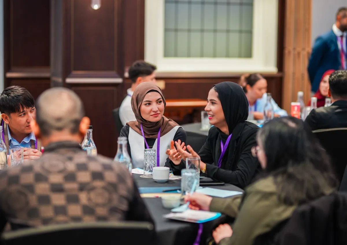 Group of CareerSeekers' participants in conversation at a round table during a Leadership Development Institute (LDI) event