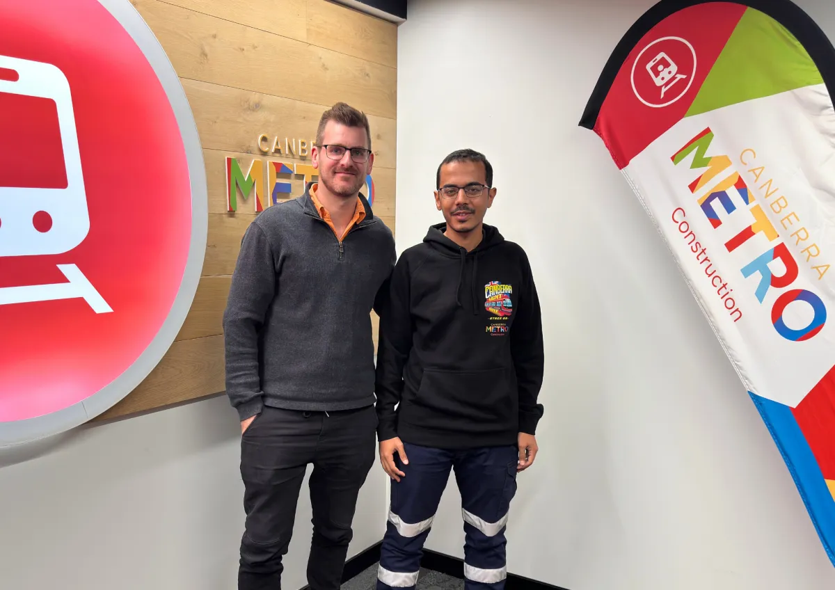 A CareerSeekers' participant and colleague posing together at the office