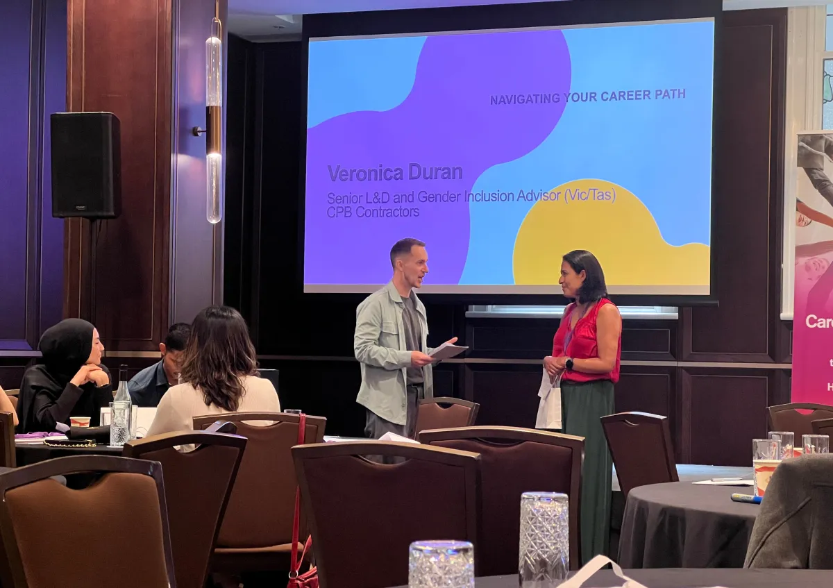 A guest speaker at a CareerSeekers Leadership Development Institute (LDI) event receiving a thank you gift from a CareerSeekers' participant