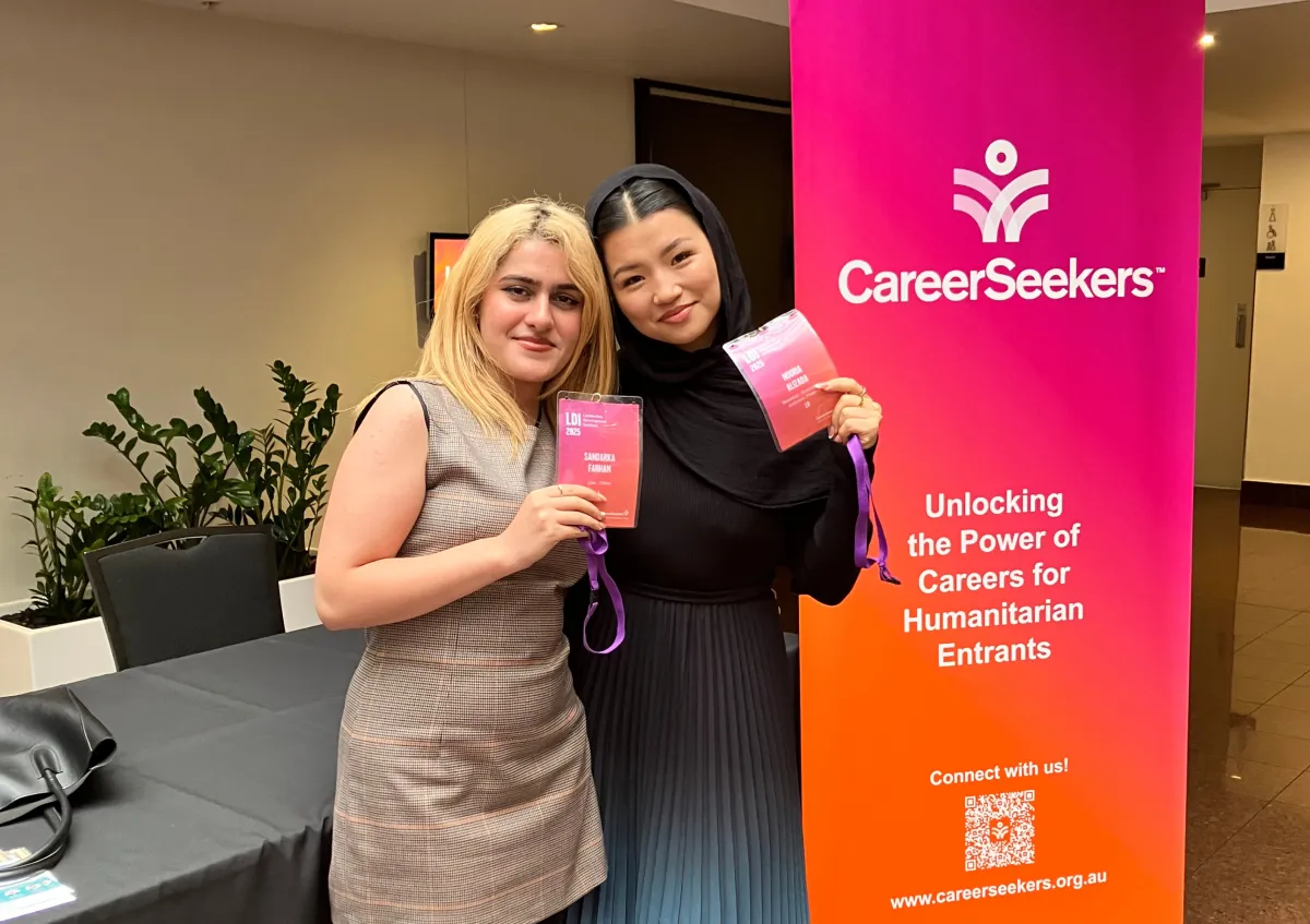 Two CareerSeekers' participants posing together in front of a CareerSeekers event