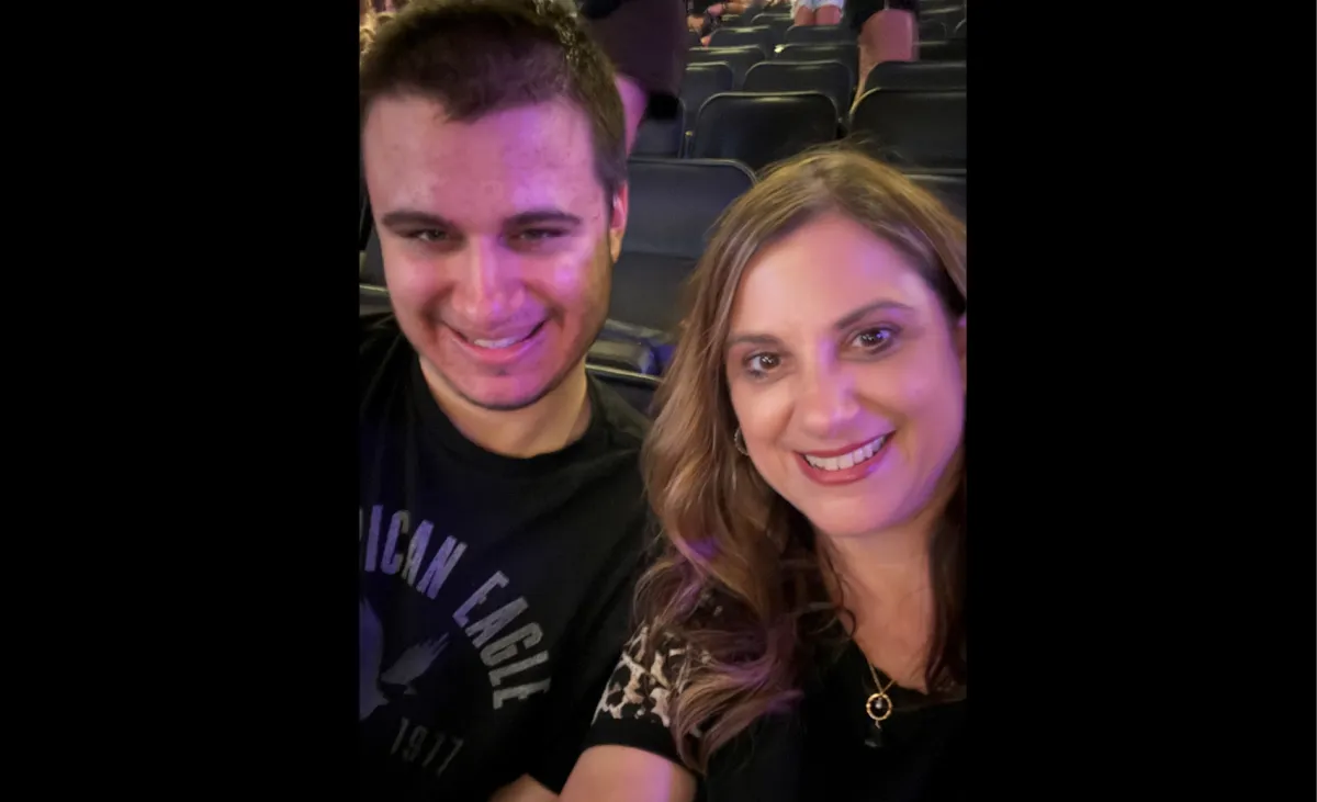 Mother and teenage son smiling at a special event — personal story of navigating autism and ADHD advocacy as a parent and attorney.