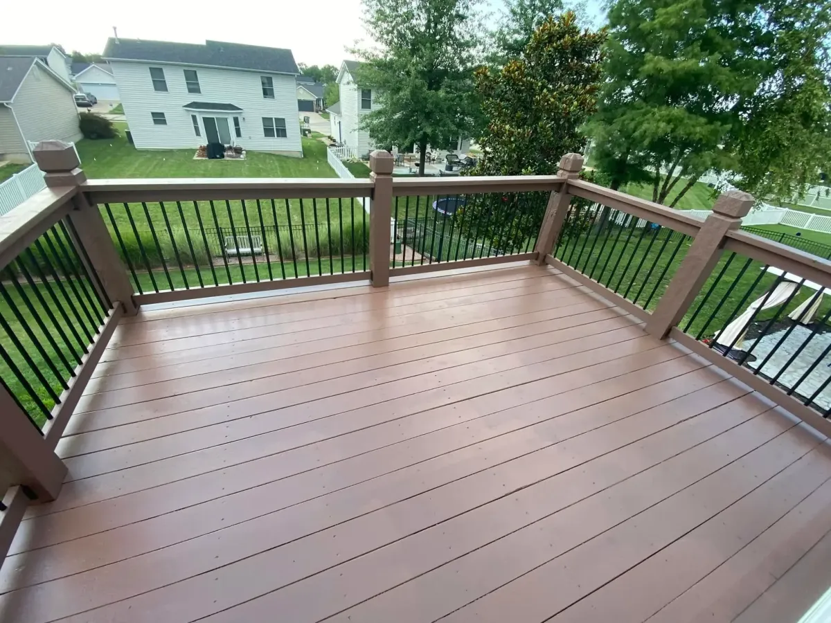 Refinished deck in Cottleville, MO with red-brown stain for a rich, updated look.