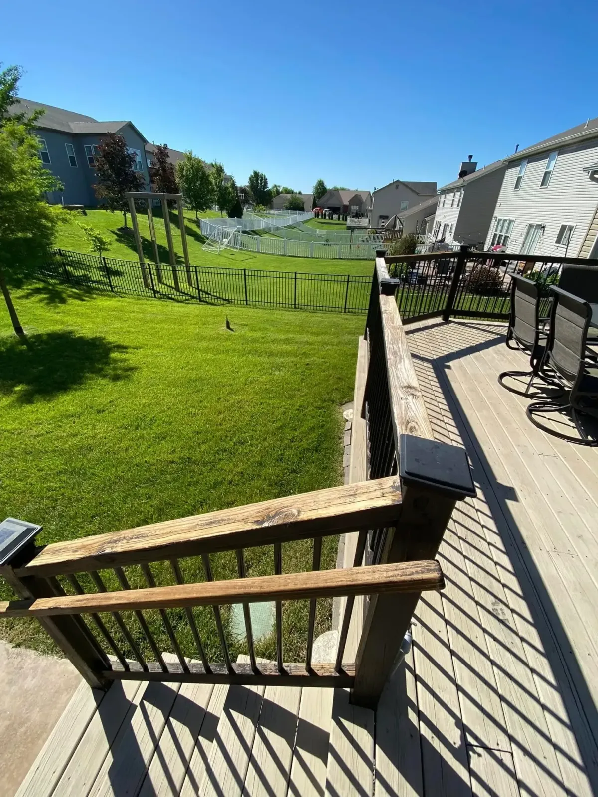Deck railing repair in Lake Cottleville, MO fixing broken spindles and rail sections.