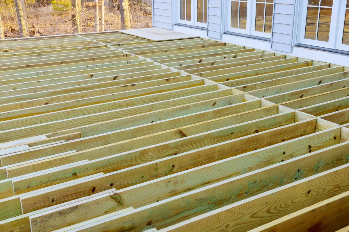 Wooden patio floor framing during deck installation in Dardenne Prairie, MO – foundation for outdoor living space.