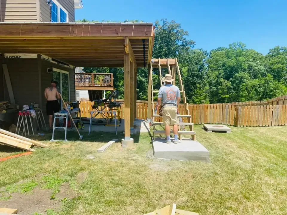 Concrete patio pressure washing service in St. Louis, MO showing before and after cleaning results.