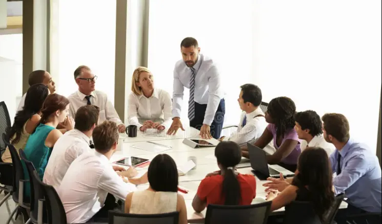 rectangular brown wooden table with chair lot inside building