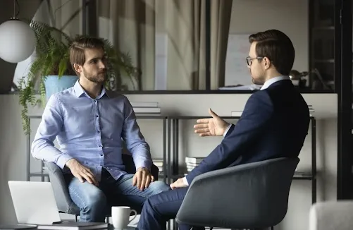 woman holding clear glass candle holder and grayscale portrait of a woman