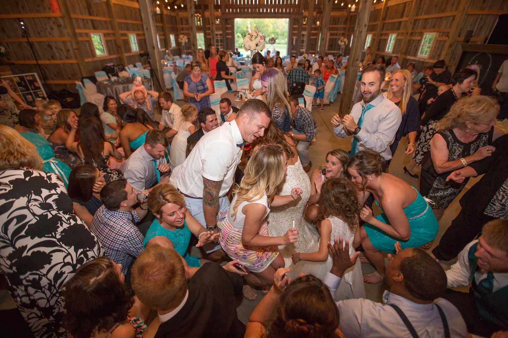 Springfield MO wedding DJ packed dance floor with the couple and guests dancing at reception