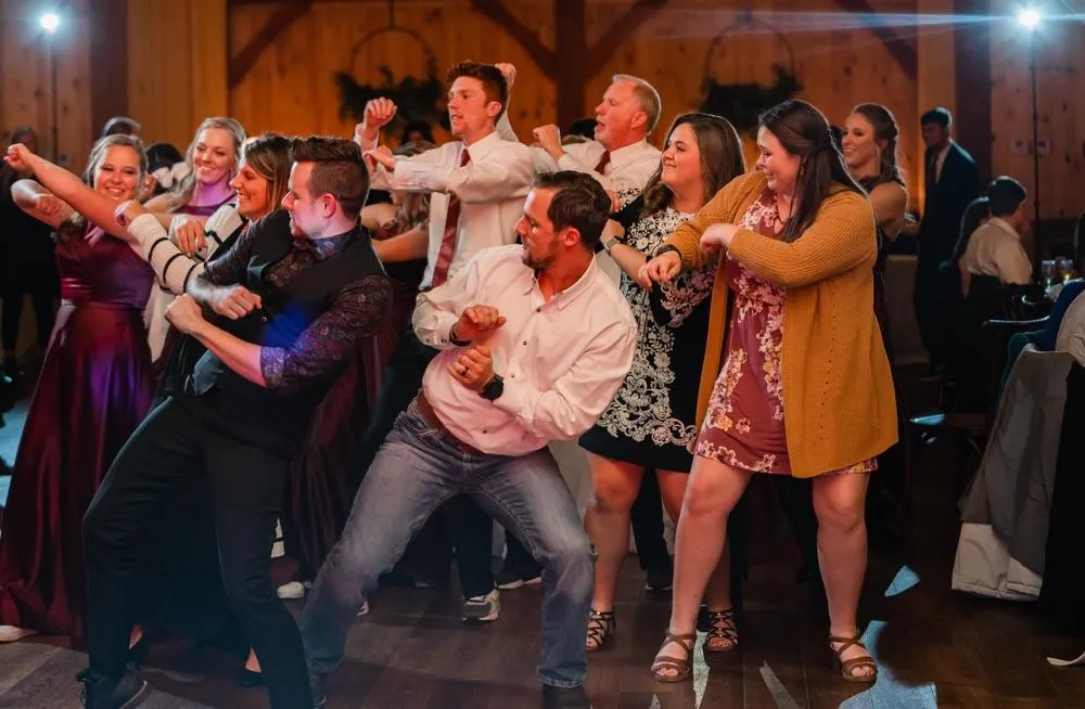 Kansas City, MO wedding DJ keeping guests engaged and dancing on full dance floor