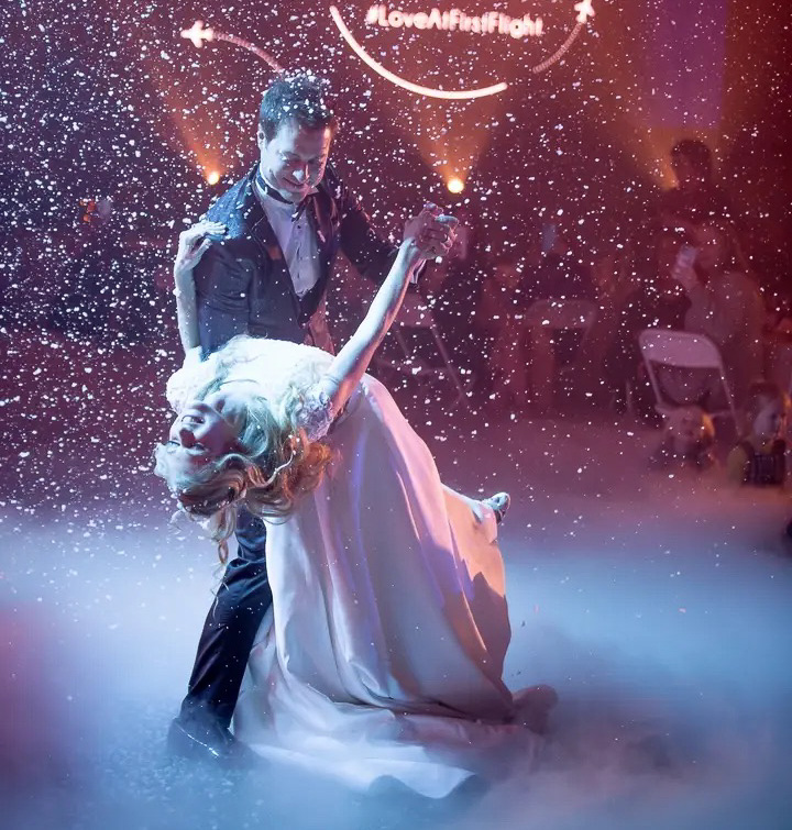 Romantic first dance with confetti and special lighting at Kansas City, Missouri wedding reception