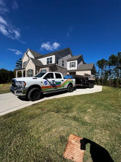 An example of junk dads junk removals van parked outside of a house in Kennesaw GA