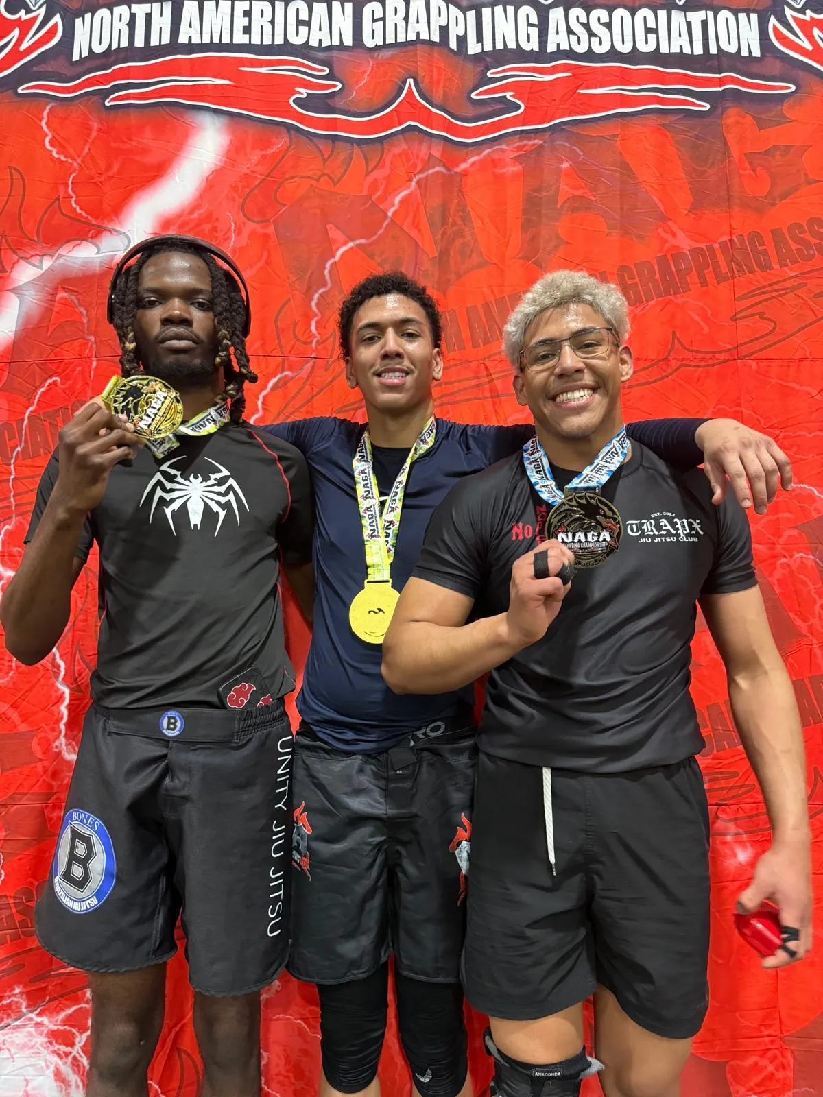 group of young adult holding their medals post competition