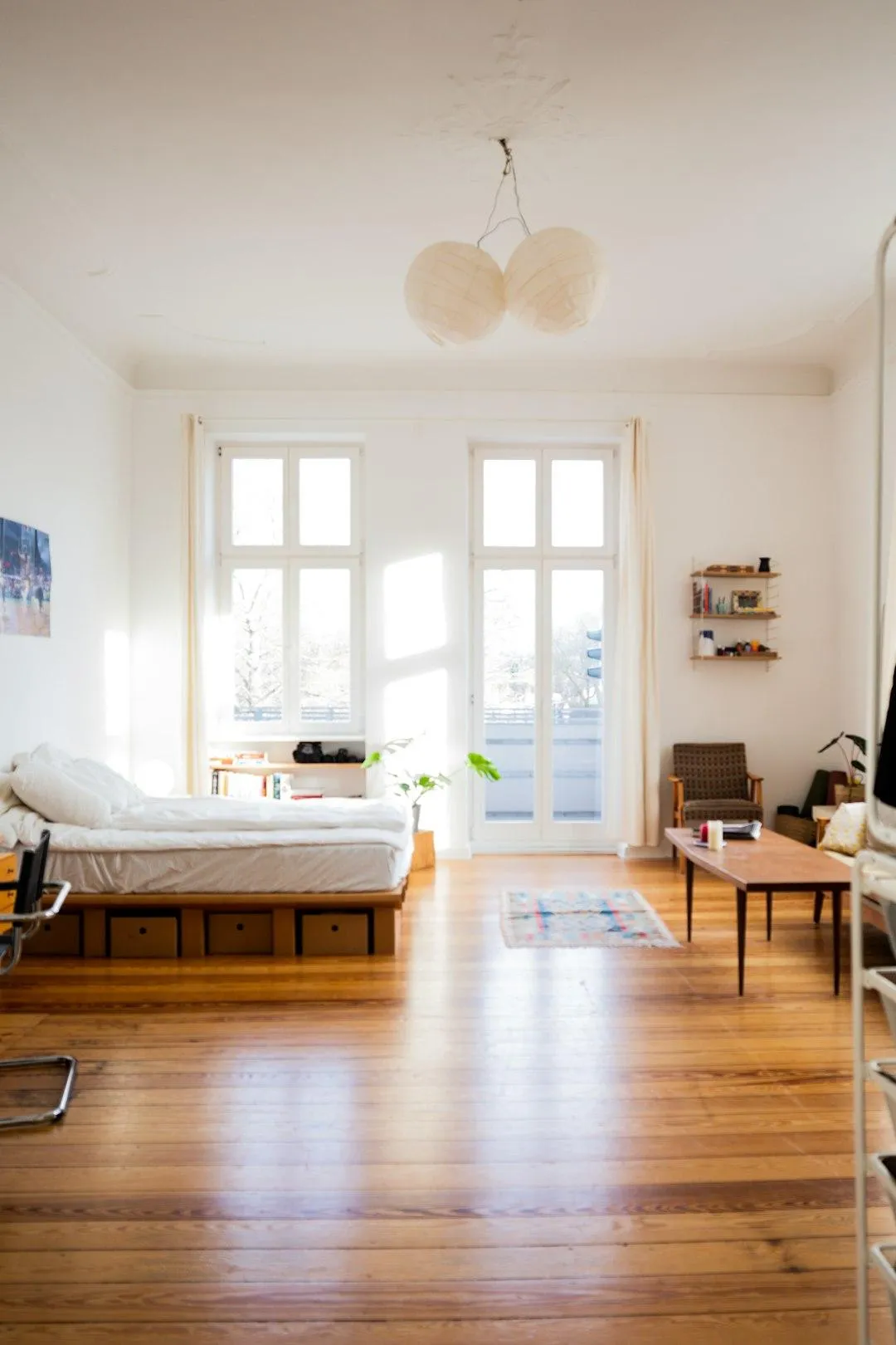 man in blue denim jacket facing turned on monitor